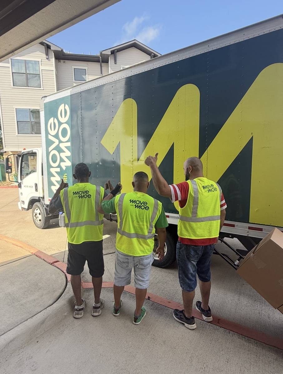 The Move with Moe crew standing in front of the truck