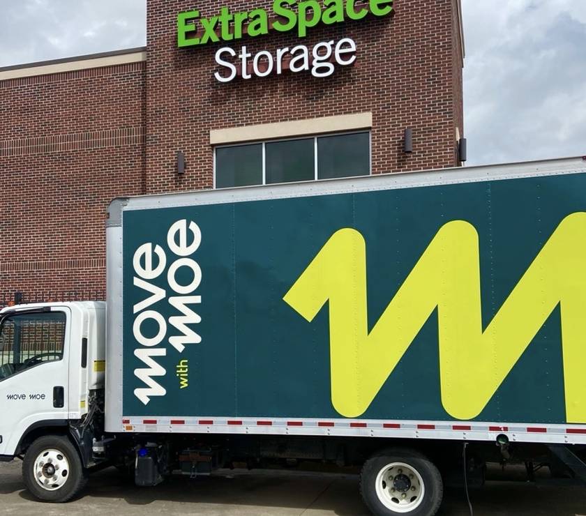 The Move with Moe truck outside an Extra Space Storage facility