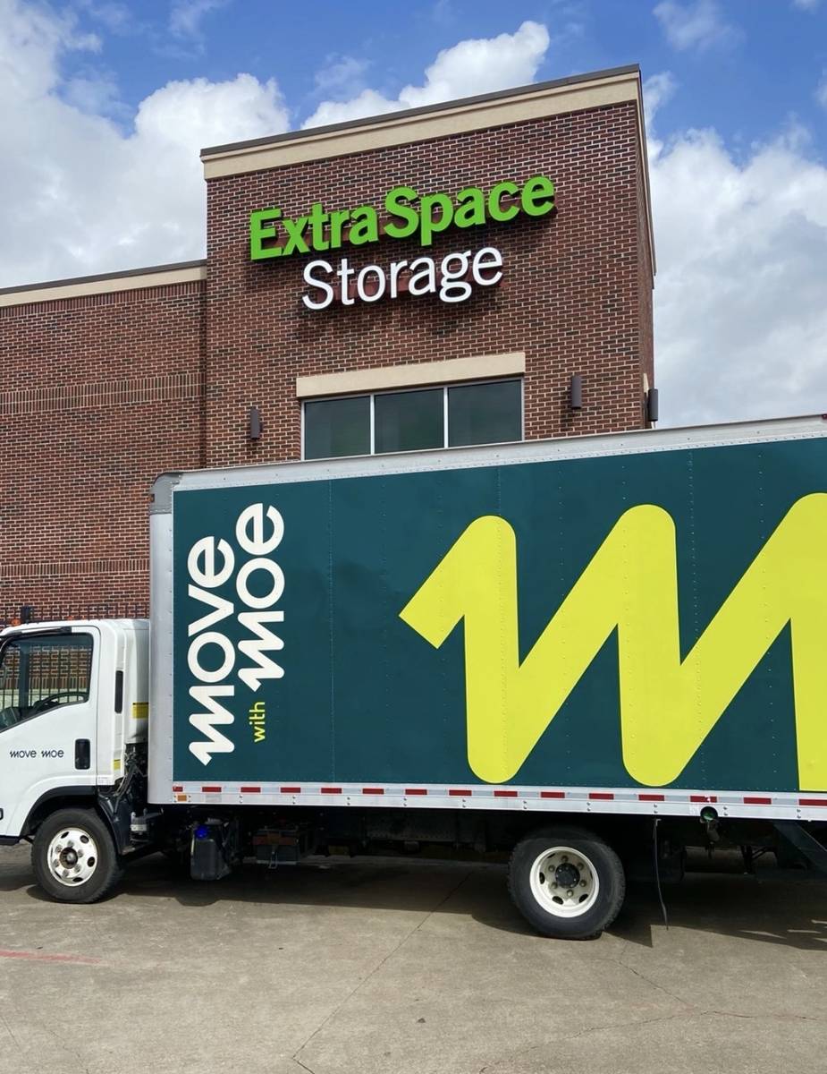 The Move with Moe truck outside an Extra Space Storage facility