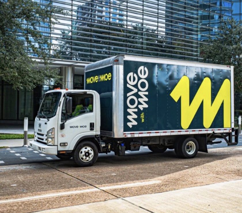 The Move with Moe truck outside an office building